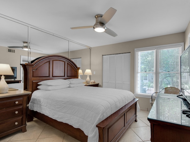 bedroom featuring multiple windows and ceiling fan