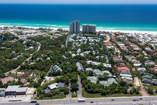 drone / aerial view with a beach view and a water view