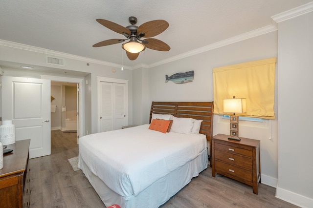 bedroom featuring ceiling fan, a closet, ornamental molding, and light wood-type flooring