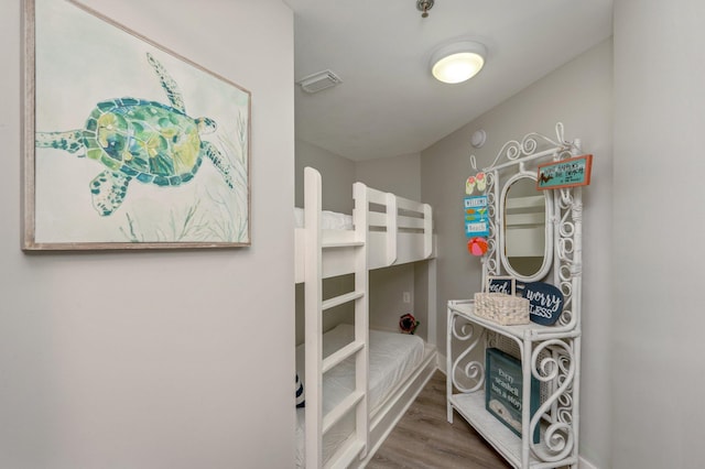 bedroom with hardwood / wood-style floors