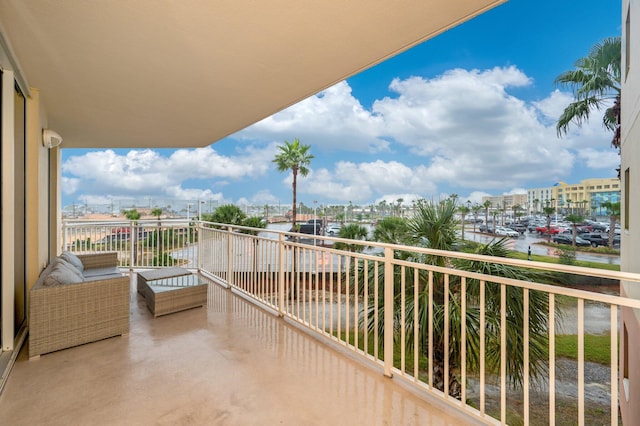 balcony featuring a water view