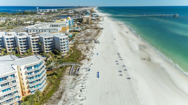 birds eye view of property featuring a water view and a view of the beach