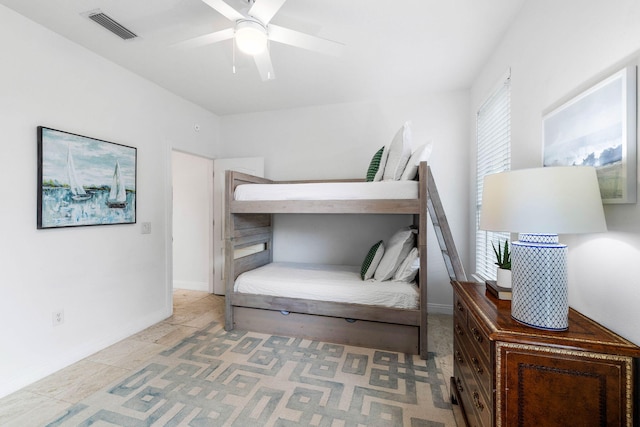 tiled bedroom with ceiling fan