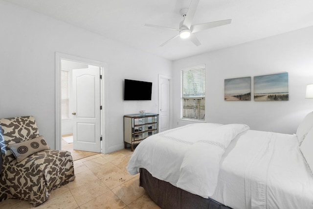 bedroom with ceiling fan and light tile patterned floors