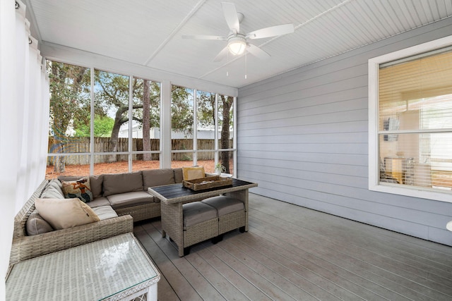 sunroom / solarium with plenty of natural light and ceiling fan