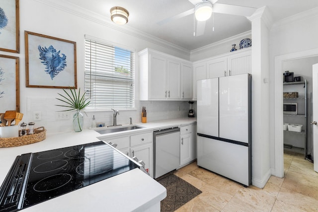 kitchen with white cabinetry, sink, appliances with stainless steel finishes, and tasteful backsplash