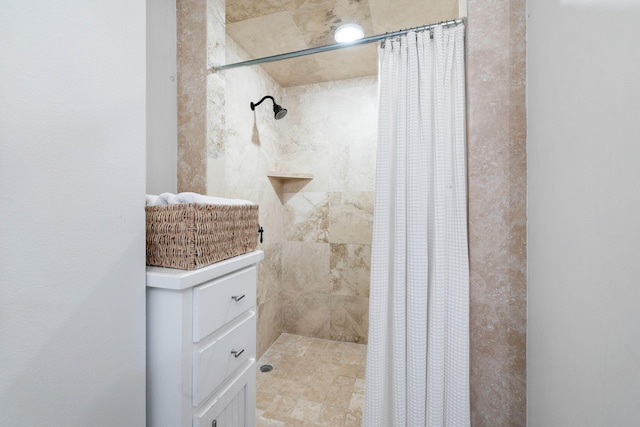 bathroom with a shower with shower curtain