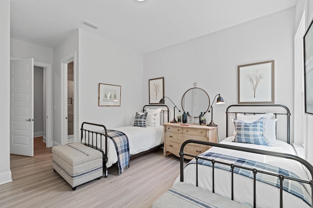 bedroom with light wood-type flooring