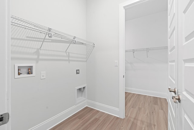 washroom featuring electric dryer hookup, hardwood / wood-style flooring, and washer hookup