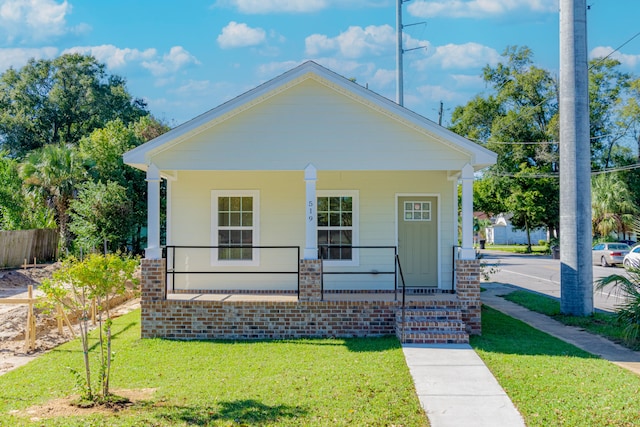 bungalow featuring a front yard and a porch