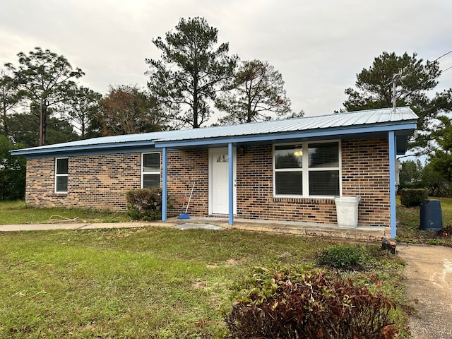 ranch-style house with a front lawn