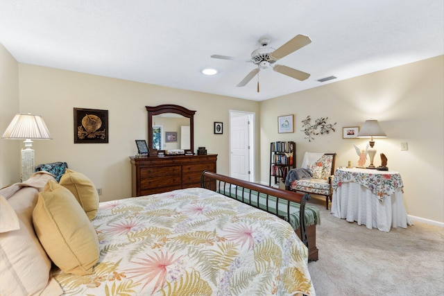 bedroom with ceiling fan and light colored carpet