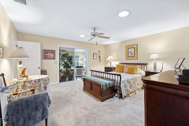 carpeted bedroom featuring access to outside and ceiling fan