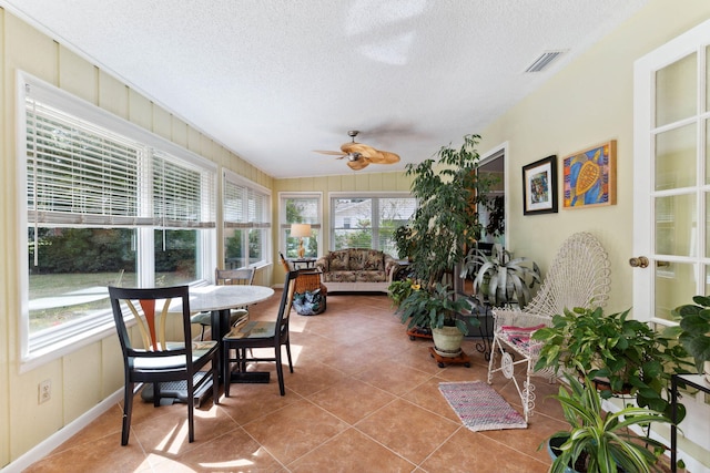 sunroom / solarium with ceiling fan