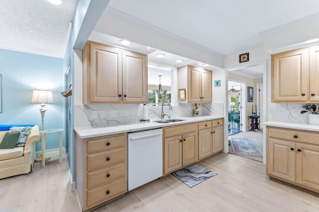 kitchen featuring light wood-type flooring, crown molding, sink, light brown cabinets, and dishwasher