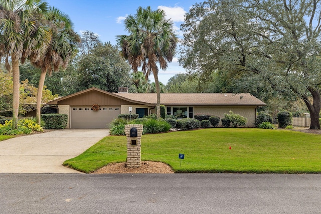 ranch-style house featuring a front yard and a garage