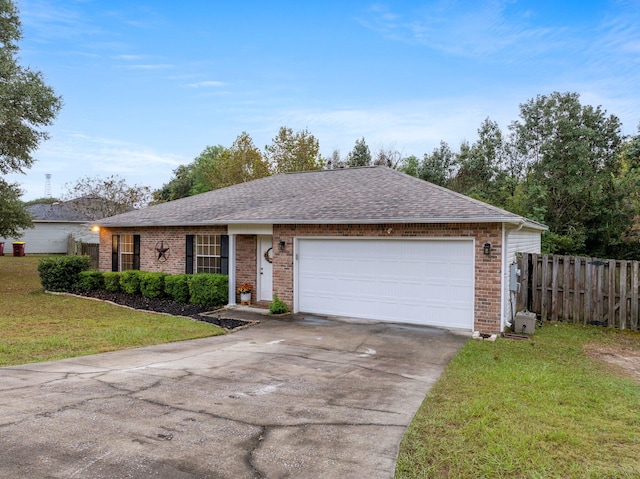 single story home with a front yard and a garage