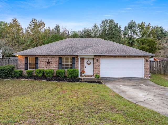 ranch-style home with a garage and a front yard