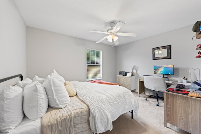 bedroom featuring light colored carpet and ceiling fan