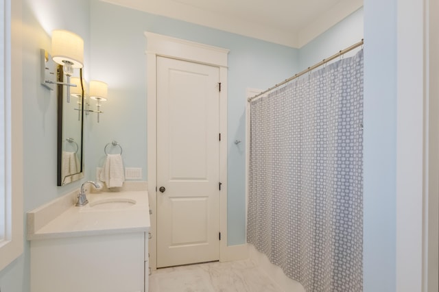 full bath with marble finish floor, curtained shower, and vanity