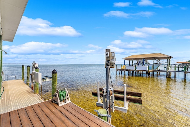 dock area featuring a water view and boat lift