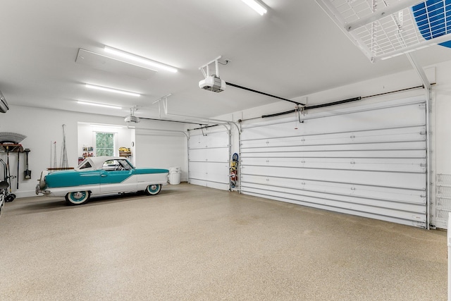 garage featuring a garage door opener