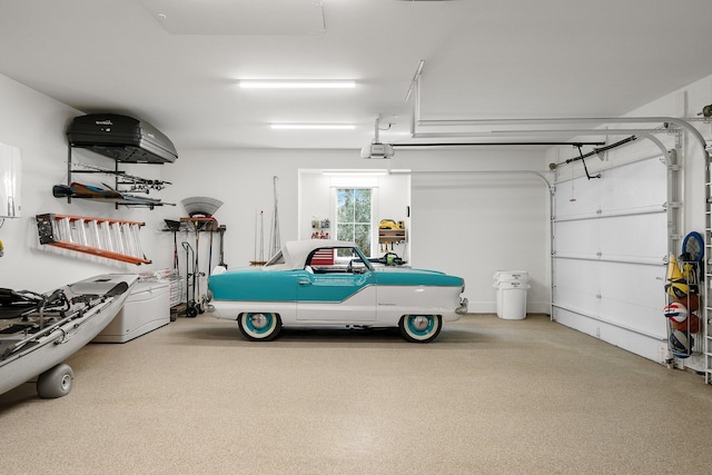 garage featuring a garage door opener