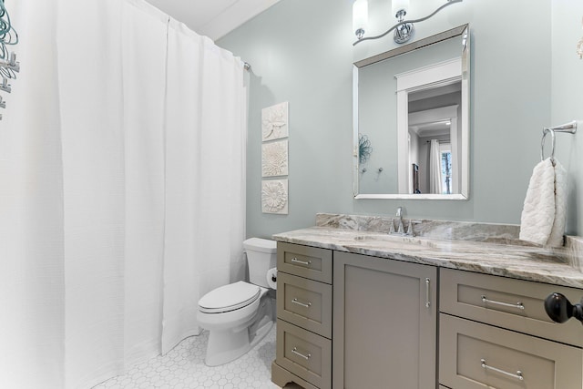 full bathroom featuring vanity and toilet