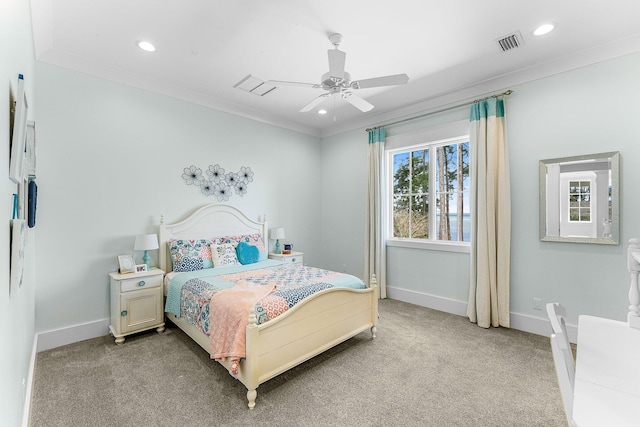 bedroom featuring baseboards, visible vents, light colored carpet, crown molding, and recessed lighting