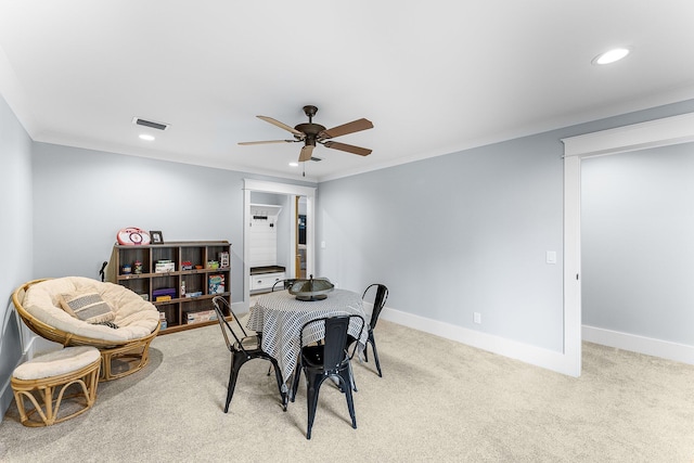 carpeted dining room featuring baseboards, visible vents, a ceiling fan, and recessed lighting