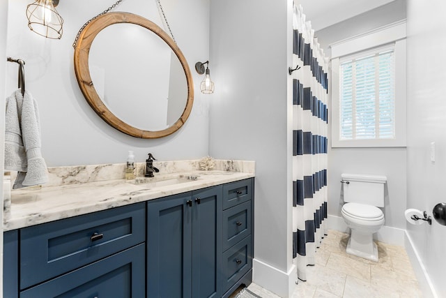 full bath with baseboards, toilet, curtained shower, tile patterned flooring, and vanity