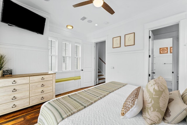 bedroom featuring ceiling fan, crown molding, and dark hardwood / wood-style flooring