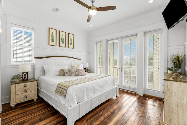 bedroom featuring access to exterior, dark hardwood / wood-style flooring, crown molding, french doors, and ceiling fan