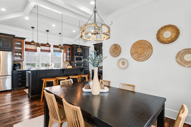 dining space with crown molding, beamed ceiling, dark hardwood / wood-style floors, and a notable chandelier