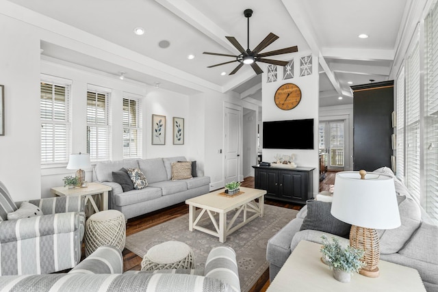 living room featuring dark hardwood / wood-style flooring, lofted ceiling with beams, and ceiling fan