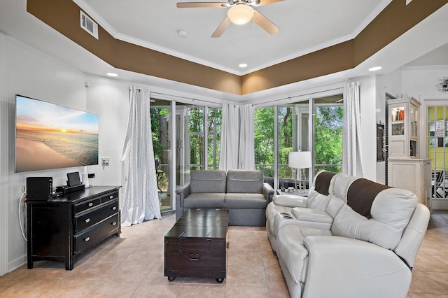 tiled living room featuring crown molding, plenty of natural light, and ceiling fan