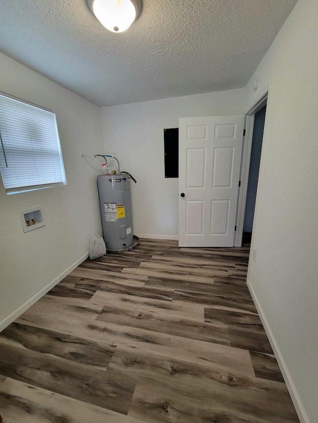 utility room with electric water heater