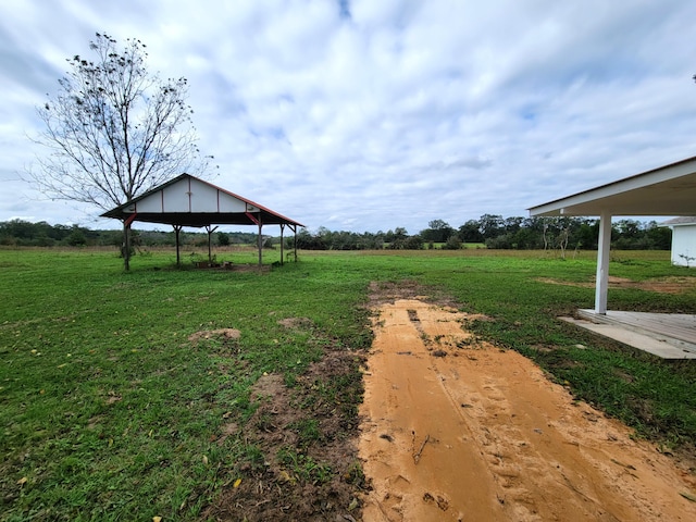 view of yard with a rural view