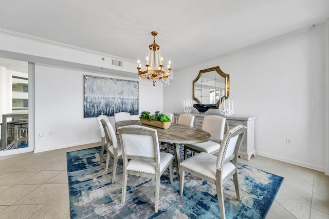 tiled dining room featuring an inviting chandelier and ornamental molding