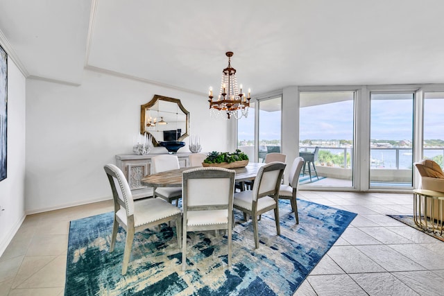 dining room with ornamental molding, a chandelier, and light tile patterned floors