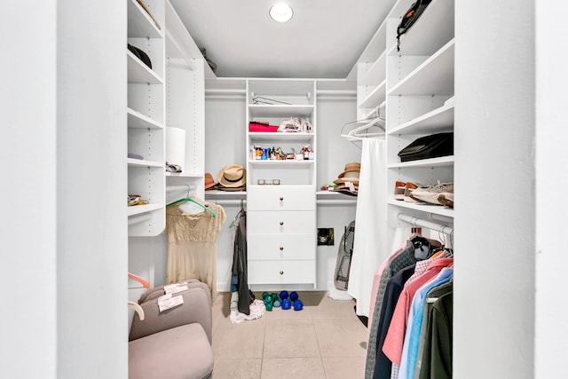 walk in closet with light tile patterned flooring