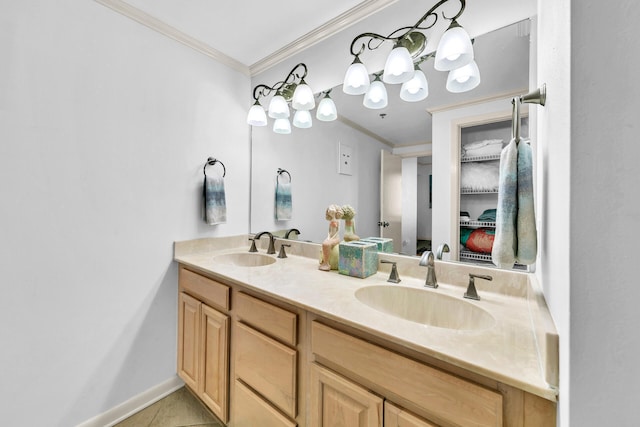 bathroom with tile patterned flooring, vanity, and crown molding