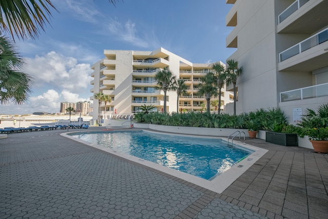 view of swimming pool with a patio