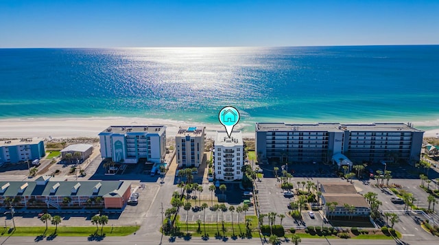 bird's eye view with a water view and a view of the beach