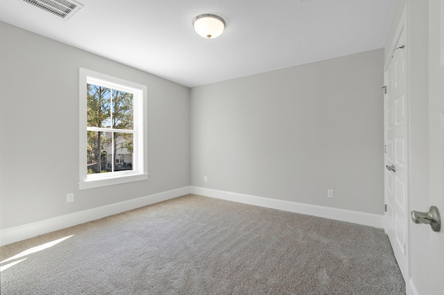 unfurnished room with carpet flooring