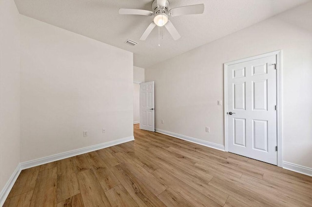 unfurnished bedroom featuring ceiling fan and light hardwood / wood-style flooring