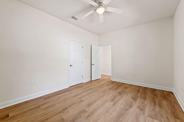 unfurnished room featuring light hardwood / wood-style flooring and ceiling fan