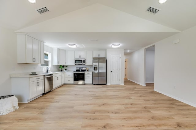 kitchen with white cabinetry, sink, light hardwood / wood-style flooring, and stainless steel appliances