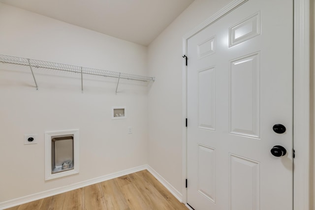 clothes washing area featuring hookup for a washing machine, hookup for an electric dryer, and light wood-type flooring