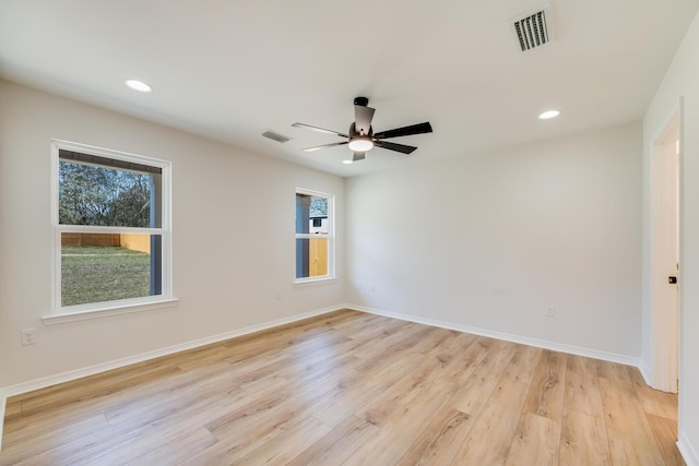 spare room with ceiling fan and light hardwood / wood-style flooring